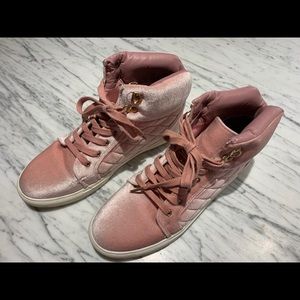 Women’s pink velvet high top sneakers.